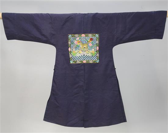 A Chinese midnight blue silk brocade robe for a military official of the 4th rank,